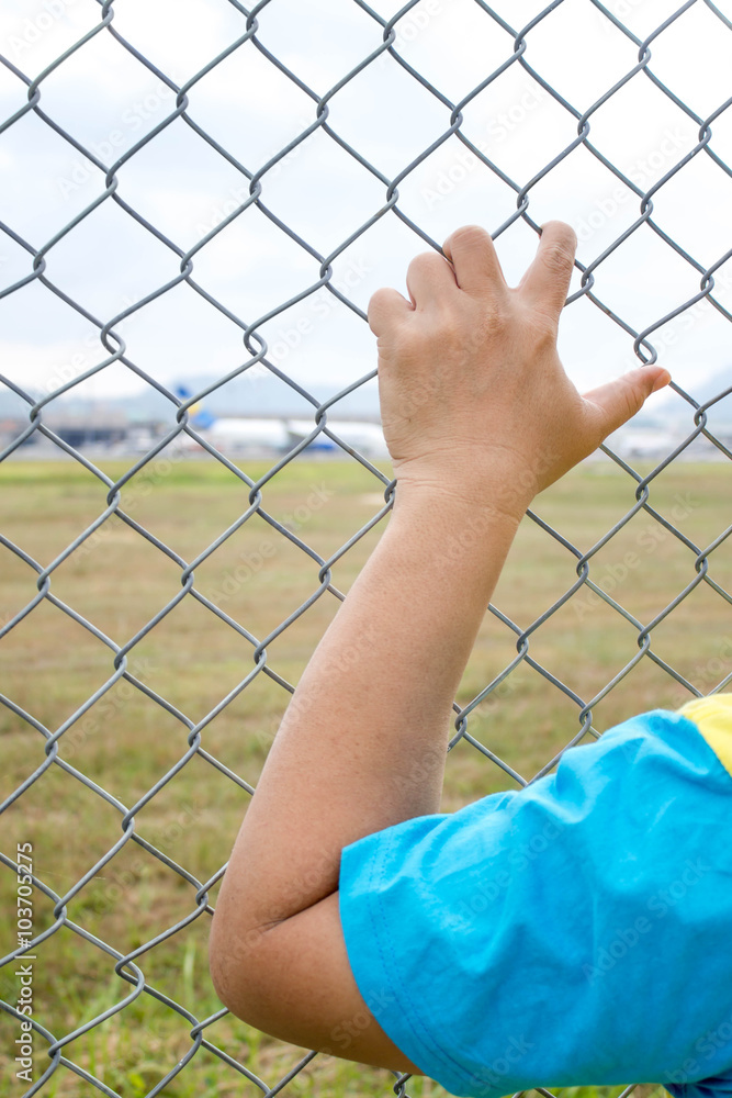 hand holding on chain link fence hand holding on chain link fence