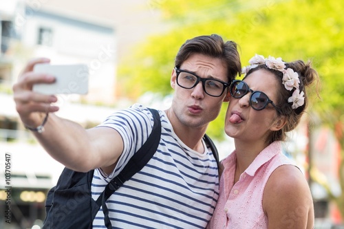Hip couple taking selfie © WavebreakMediaMicro