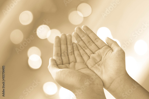 human open empty hands with palms up over blurred background photo