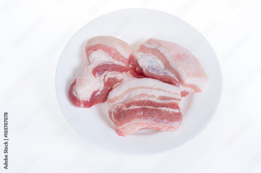 Pork belly on white plate isolated on white background