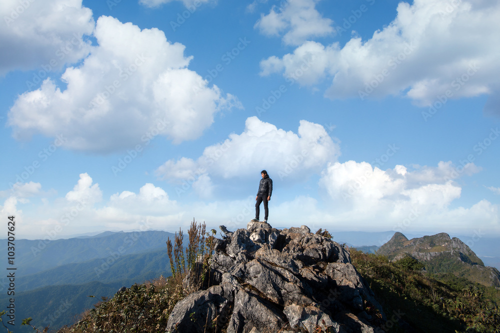 Mountain top with young southeast asian man standing