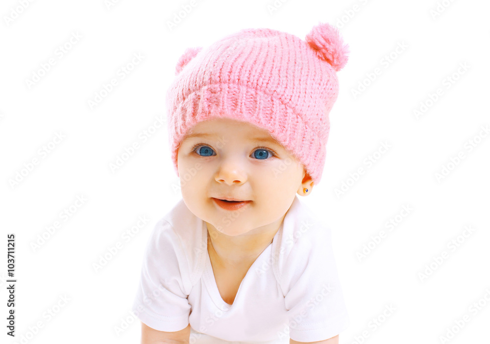 Portrait cute smiling baby in knitted pink hat on white backgrou Portrait cute smiling baby in knitted pink hat on white backgrou