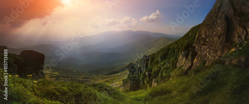 Panorama. Carpathian Mountains. View from Mount Pop Ivan. The rays of the setting sun