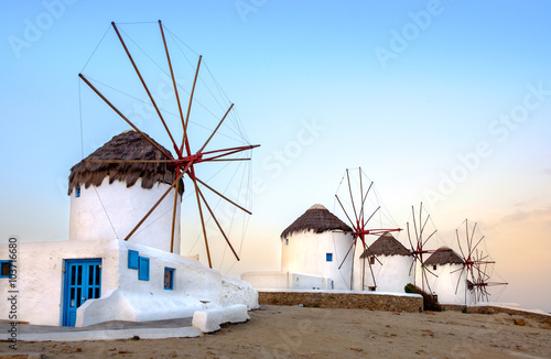 Traditional greek windmills on Mykonos island at sunrise, Cyclad