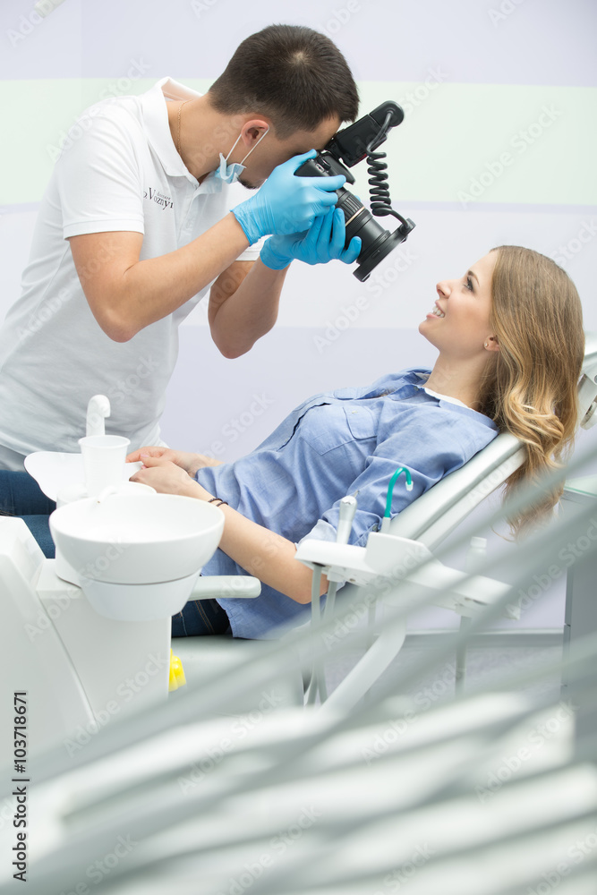 Dentist with camera and patient Dentist with camera and patient