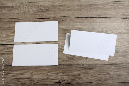 Blank flyer over wooden background to replace your design.