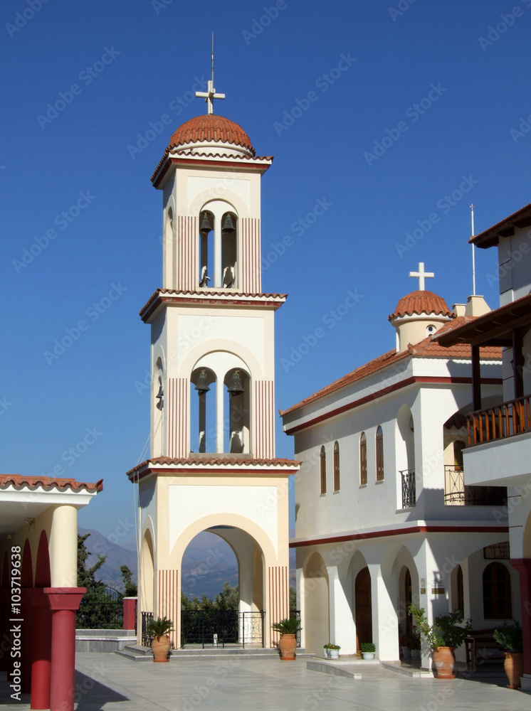 Obraz premium Bell Tower of Church Pedros and Pavlos in beautiful, traditional village Spili - Crete, Greece