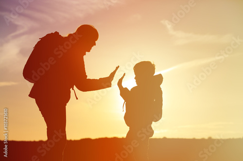 mother and little son travel at sunset