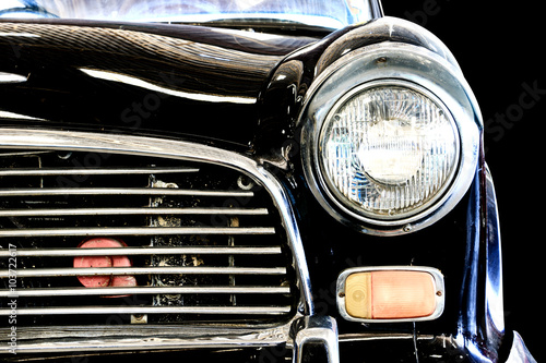 Close Up of Headlight Lamp Vintage Classic Car. (Vintage Effect Style) © wittayayut