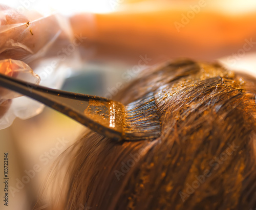 Beauty routine of coloring hair with natural henna.