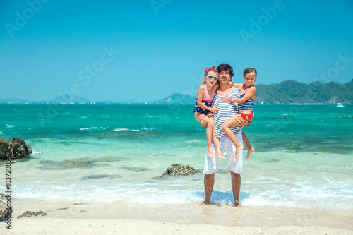 Family at the beach © Alena Ozerova