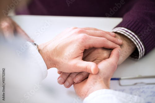 Helping the senior holding hand