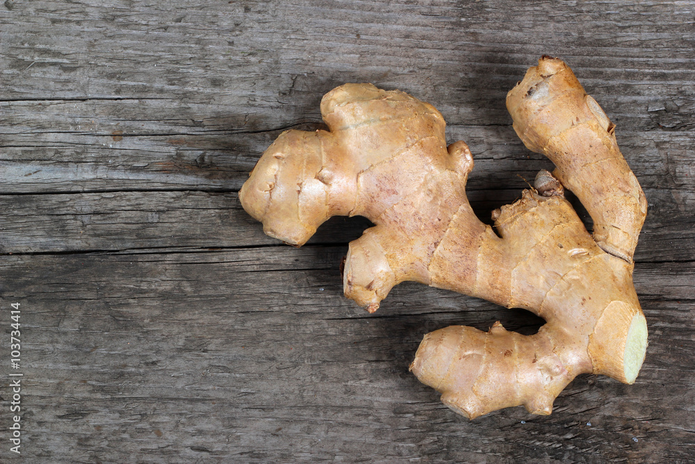 Ginger root on old wooden table Ginger root on old wooden table