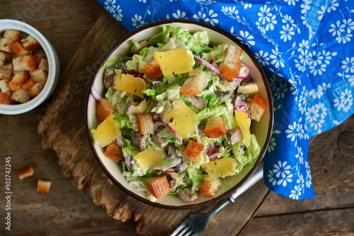 Chinese cabbage salad with croutons, cheese and delicate sauce