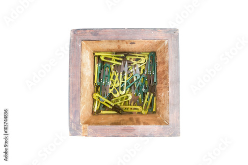 Scissors in wood box on isolated