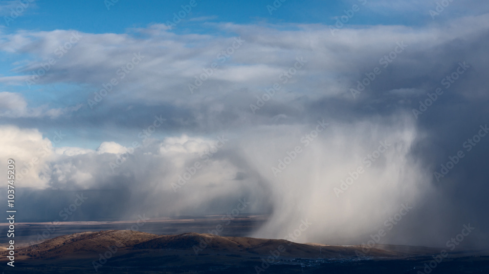 Snowstorm over hills