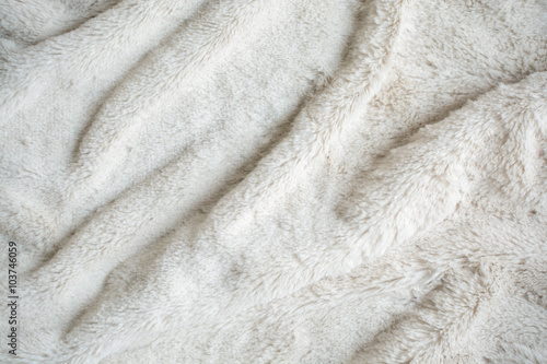 rippled white fur background and textile