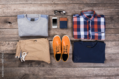 Men's clothes on wooden board