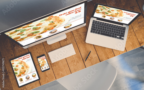 top view workplace with devices showing responsive order online