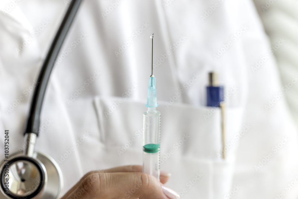Close up of doctor with syringe Close up of doctor with syringe