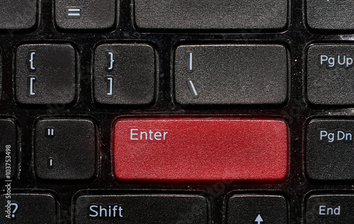 red enter button on black keyboad photo