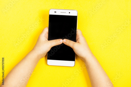 smartphone in the hands of a child