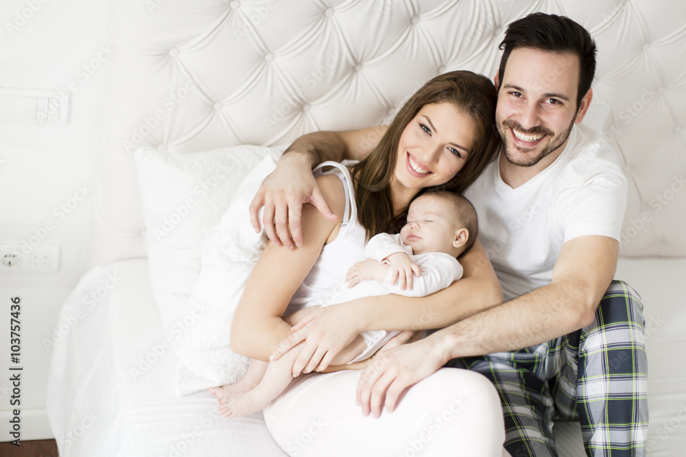 Happy family with newborn baby