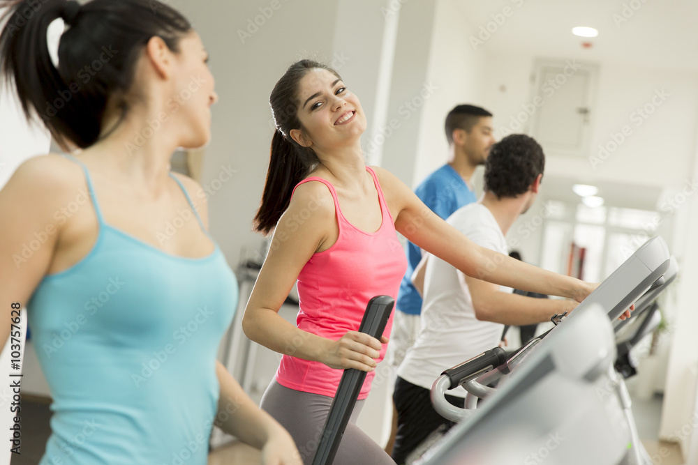Young people training in the gym Young people training in the gym