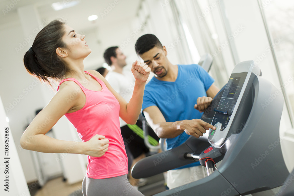 Fototapeta premium Young people training in the gym