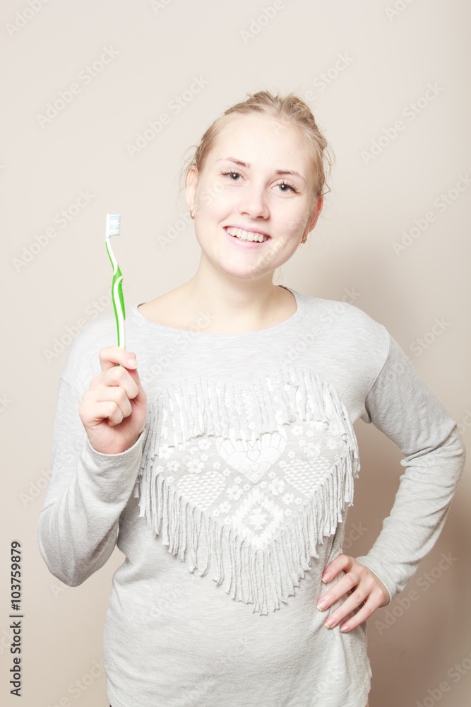young beautiful woman brushing her teeth young beautiful woman brushing her teeth