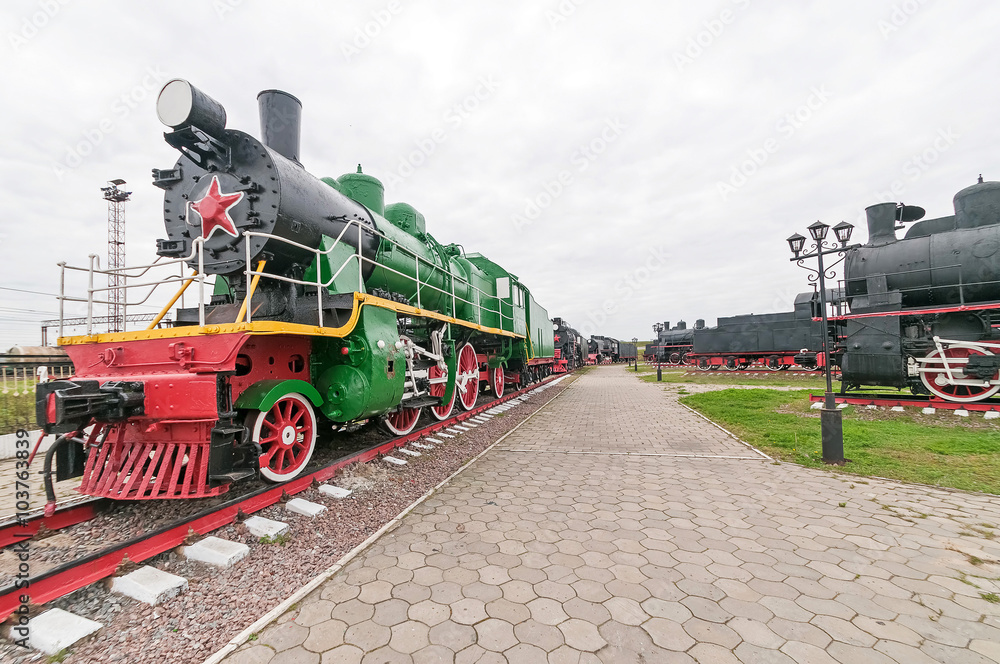Obraz premium Old steam locomotive on cloudy sky background. Nizhniy Novgorod, Russia.