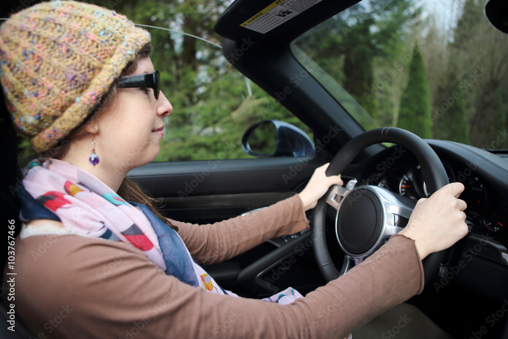 Young woman driving a car.