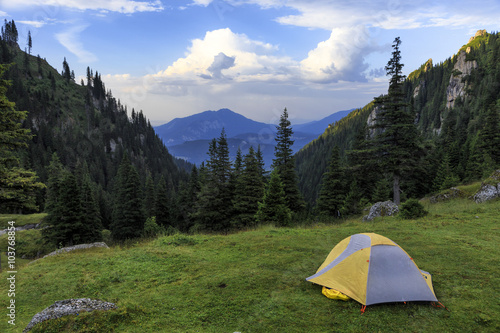 Camping in tent on the mountains.