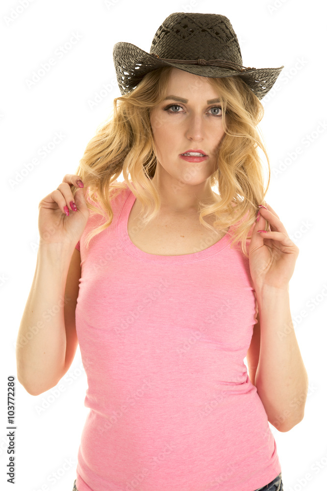 cowgirl in pink shirt black hat play with hair cowgirl in pink shirt black hat play with hair