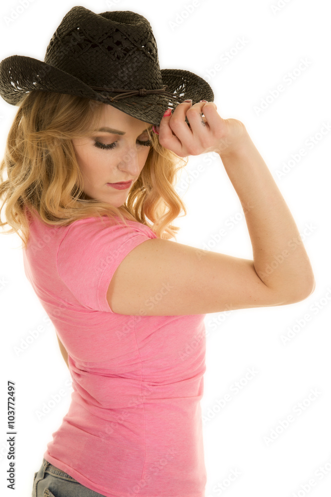 cowgirl in pink shirt black hat touch rim cowgirl in pink shirt black hat touch rim
