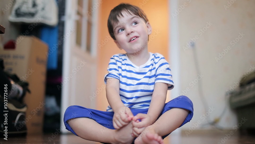 kid in a striped shirt playing kid in a striped shirt playing