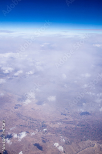 Blue sky background with tiny clouds © Pakhnyushchyy