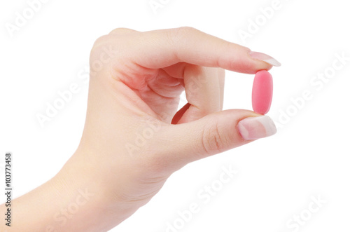 close up round white pill in hand