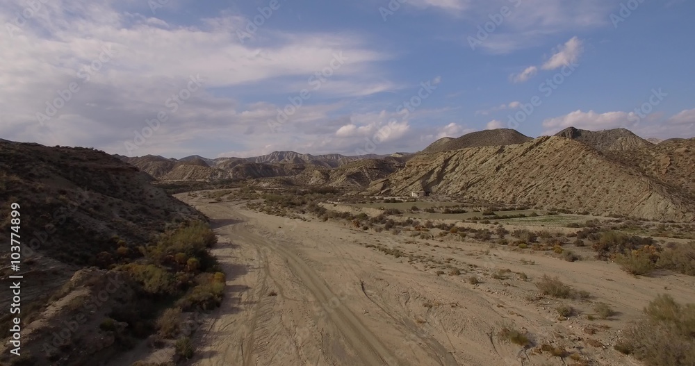 4K Aerial, Flight over a dry riverbed in a desert in Andalusia, Spain - Shot is straight out of the camera, no recompression. Watch for the graded and stabilzed versions in my portfolio