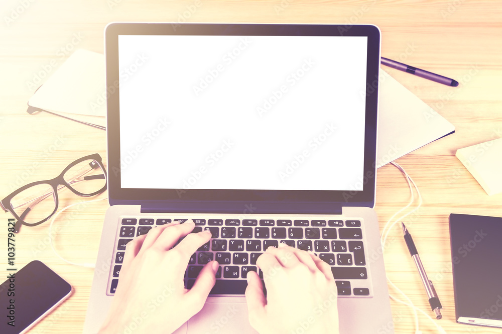 Blank white laptop screen with girl hands and office accessories Blank white laptop screen with girl hands and office accessories