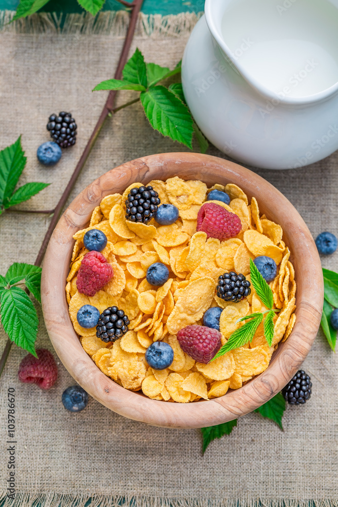 Sweet cornflakes with milk and berry fruits Sweet cornflakes with milk and berry fruits