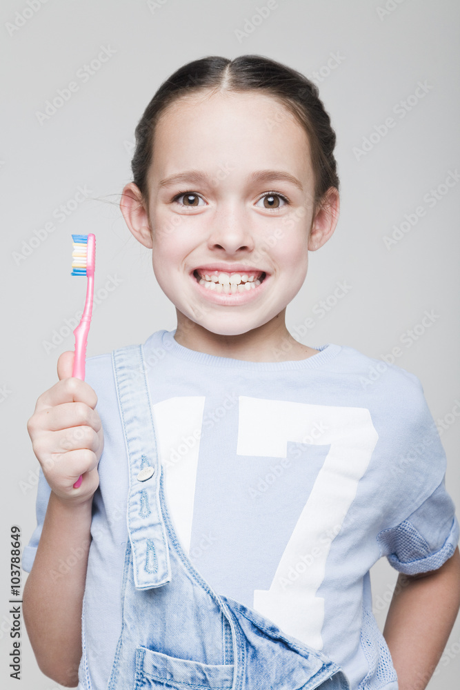 smiling little girl brushing her teeth, smiling little girl brushing her teeth,