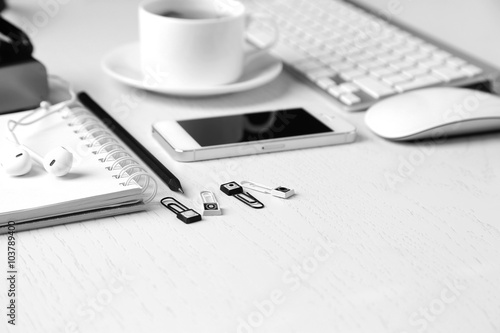 Office table with supplies and gadgets