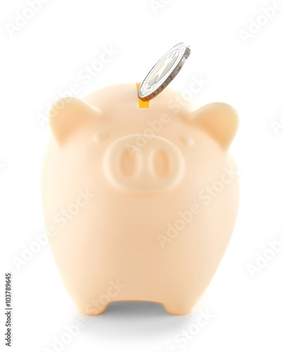 Piggy bank with coin isolated on white