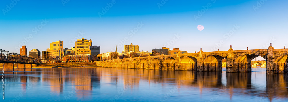 Harrisburg, Pennsylvania skyline with the historic Market Street Bridge reflected on the Susquehanna River at sunset