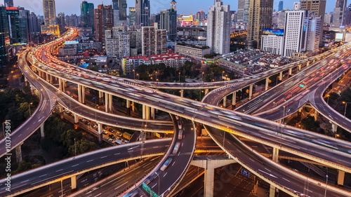 4k (4096x2304) : Aerial view of freeway, busy city rush hour heavy traffic jam highway,Shanghai,China. From day to night time-lapse. photo