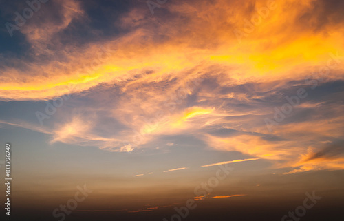 twilight sky with colorful sunset and clouds at beach
