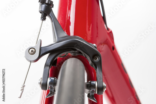 Bicycle Concept. Partial View of Professional Road Bike Wheel With Brake Calipers in Front