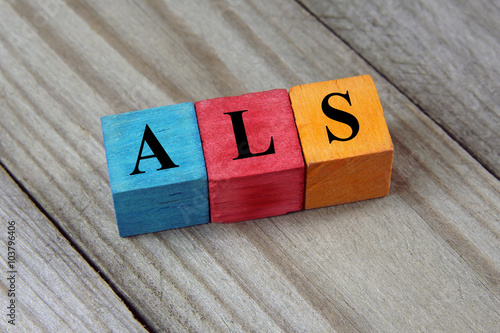 ALS (Amyotrophic Lateral Sclerosis) acronym on colorful wooden c photo