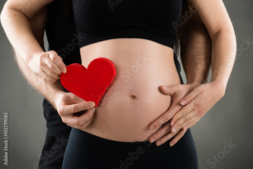 Wallpaper Mural Man Holding Heart Shape With Pregnant Woman Torontodigital.ca